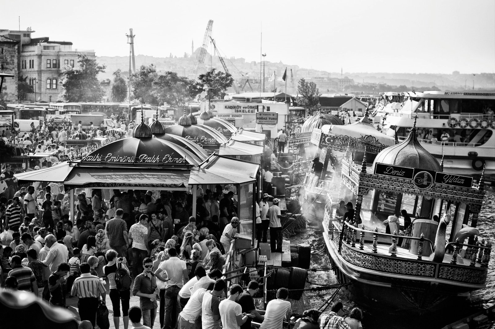 grayscale photo of people riding boats